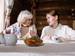 grandmother and a teenager having tea together