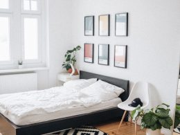 black platform bed with white mattress inside bedroom