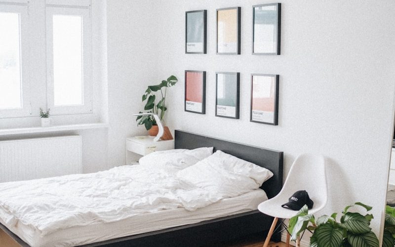 black platform bed with white mattress inside bedroom