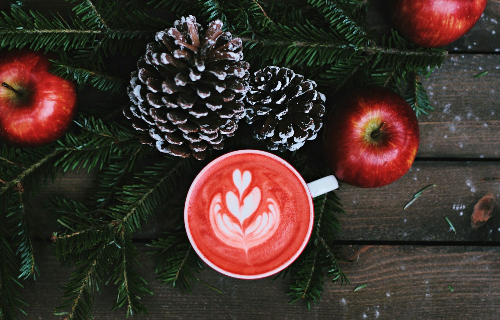 red coffee latte on white ceramic mug