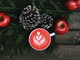 red coffee latte on white ceramic mug