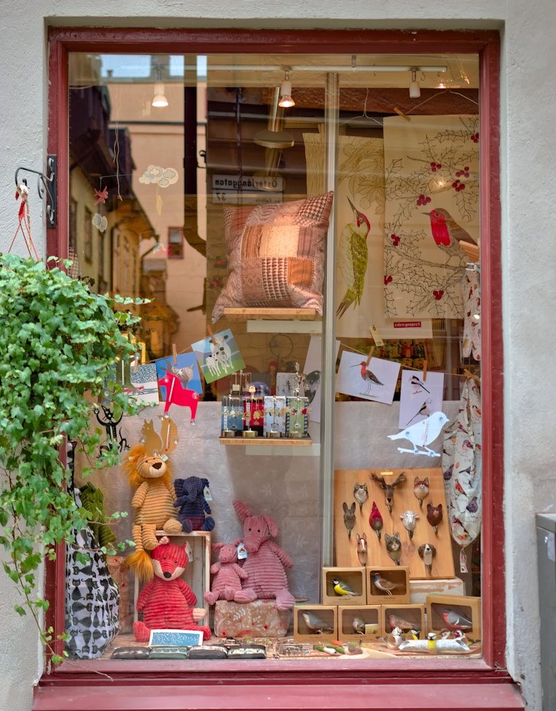 red wooden framed glass window