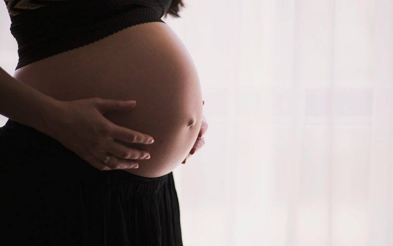 woman holding stomach