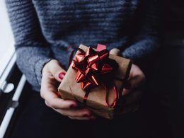 person holding present box